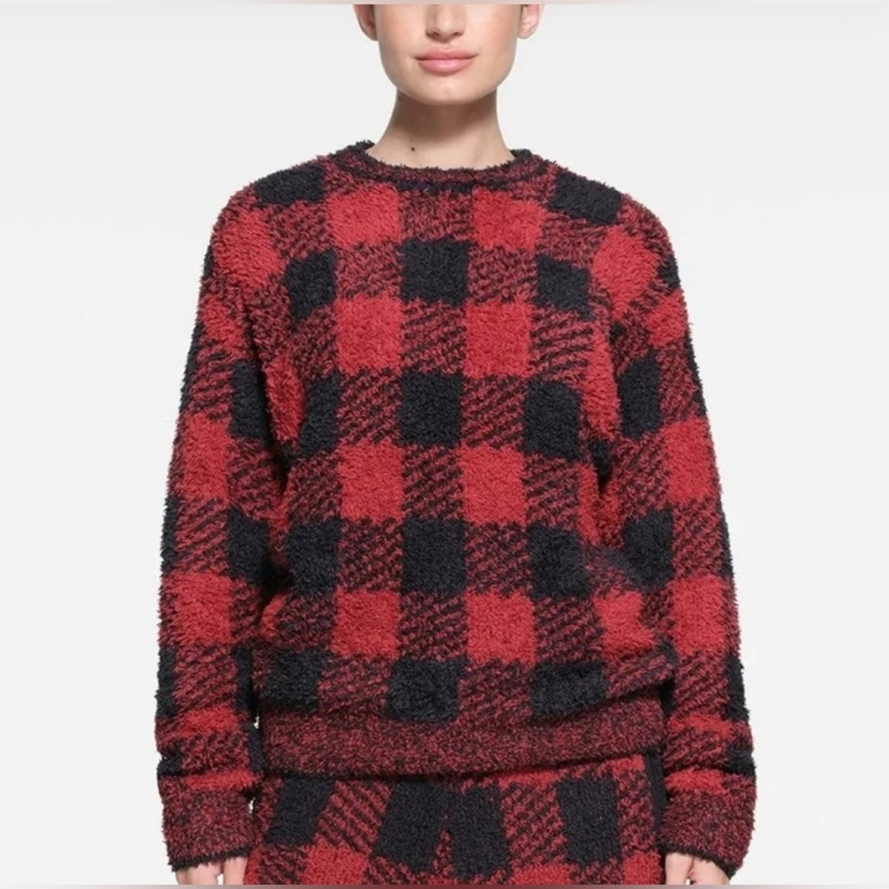 SKIMS Cozy Knit Unisex Pullover Sweater in the red and black pattern